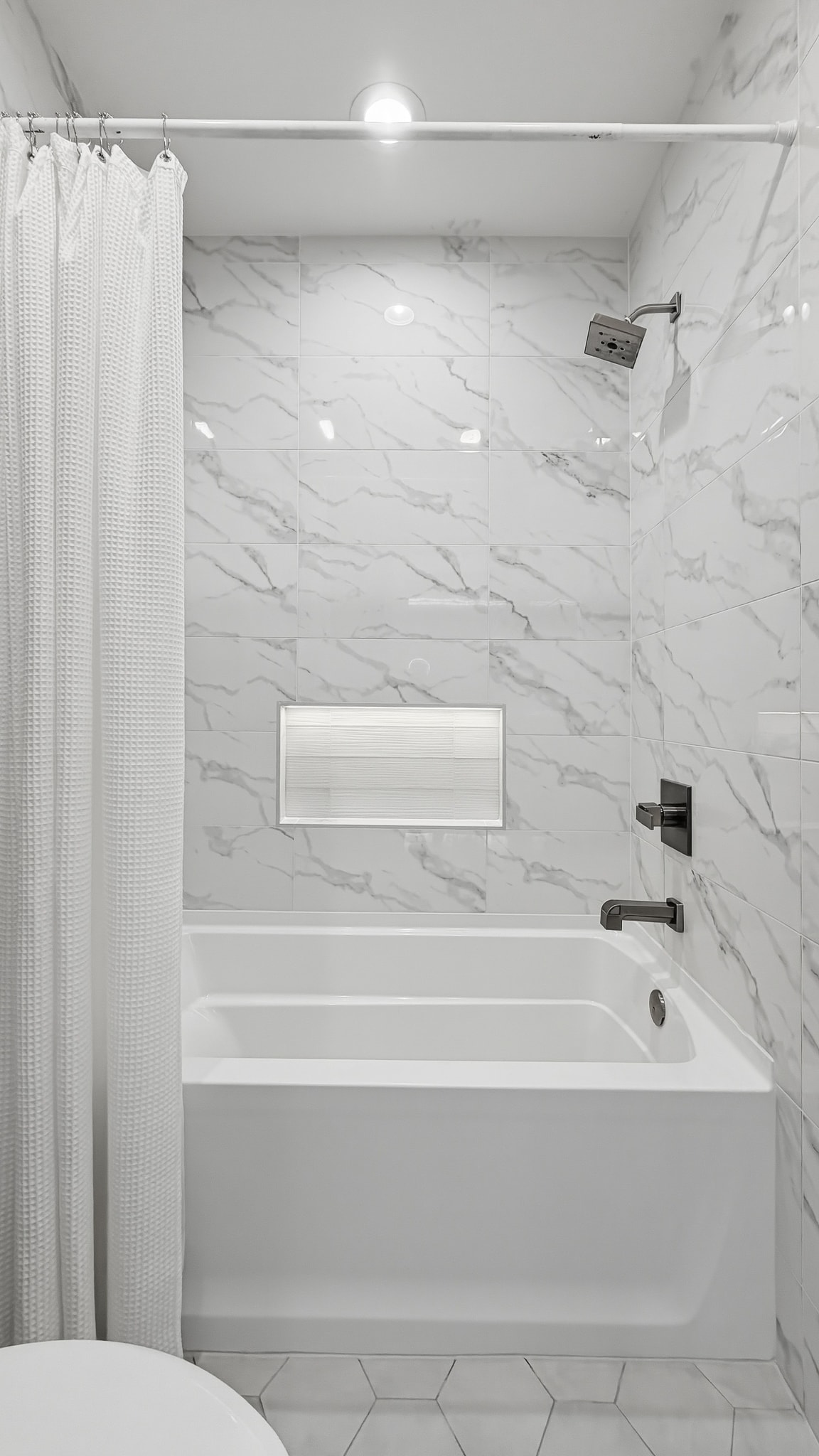 Marble tile tub and shower surround with curtain